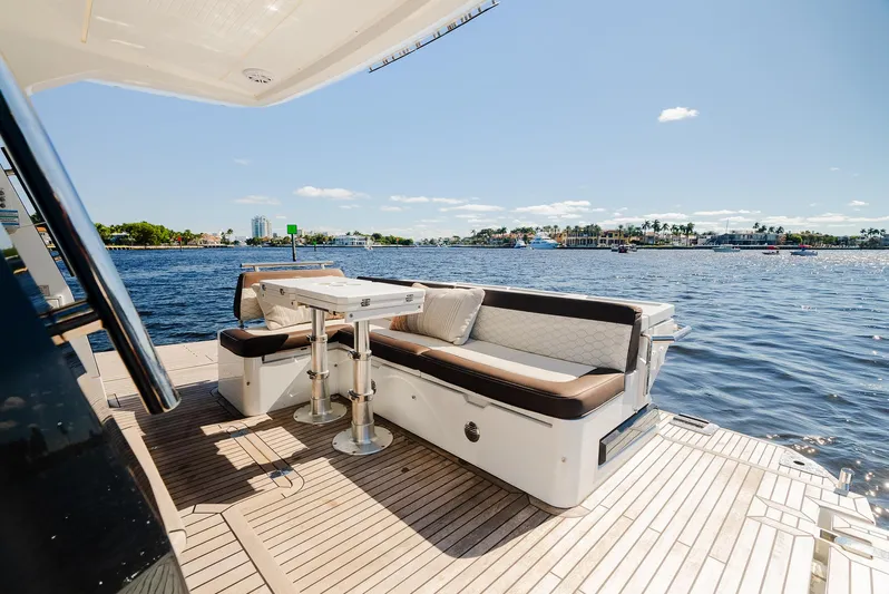 Lei Vola Yacht Photos Pics Galeon 400 Fly 2022 yacht deck with seating area overlooking serene waters.