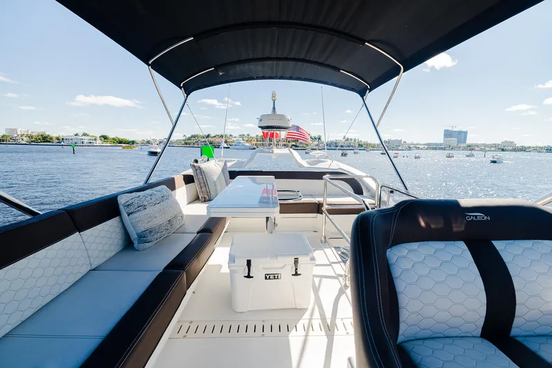 Lei Vola Yacht Photos Pics Luxurious 2022 Galeon 400 Fly yacht interior with seating and table on a sunny day.