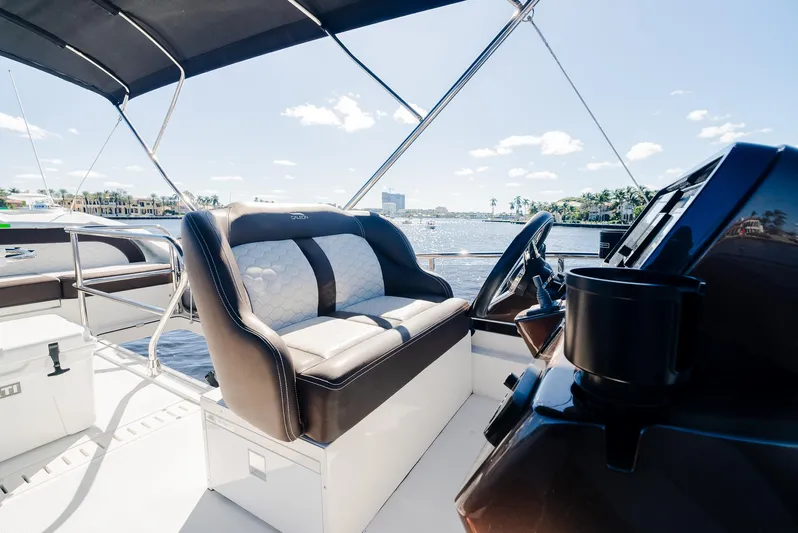 Lei Vola Yacht Photos Pics Galeon 400 Fly 2022 yacht helm with luxurious seating and scenic water view.