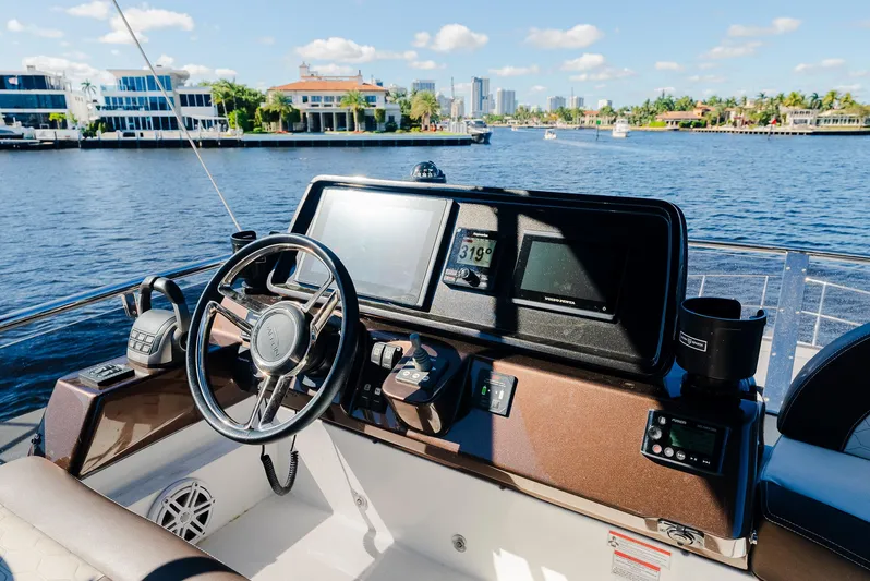Lei Vola Yacht Photos Pics Helm of 2022 Galeon 400 Fly yacht with waterfront view.