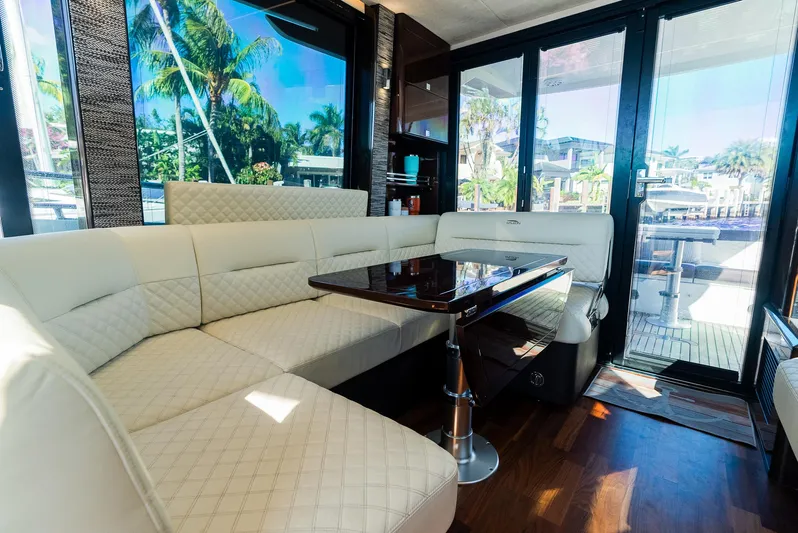 Lei Vola Yacht Photos Pics Luxurious interior of 2022 Galeon 400 Fly yacht with elegant seating and table.
