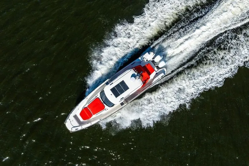  Yacht Photos Pics Aerial view of 2023 Nimbus Tender 11 boat speeding on water.