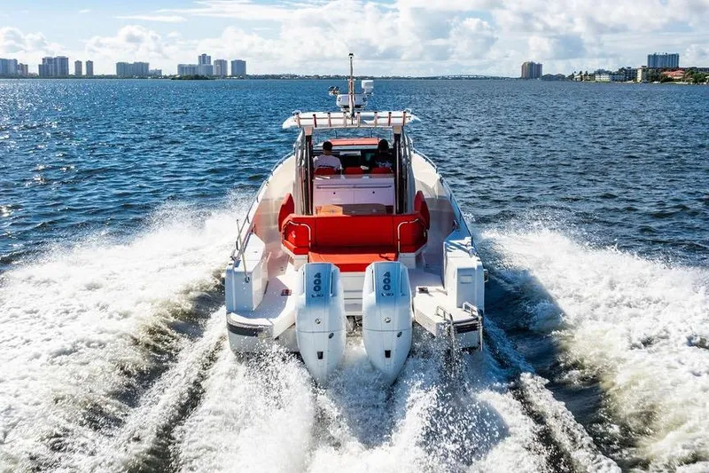  Yacht Photos Pics 2023 Nimbus Tender 11 cruising on open water with twin engines.