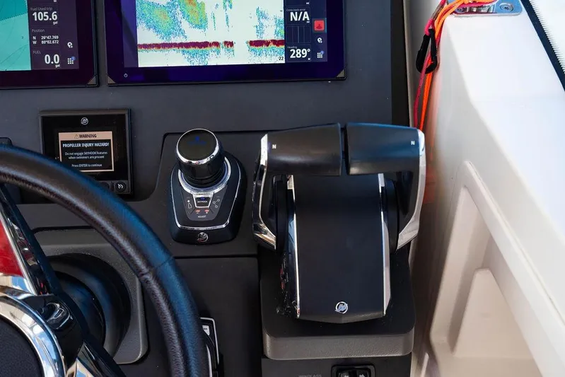  Yacht Photos Pics 2023 Nimbus Tender 11 dashboard with controls and navigation screens.