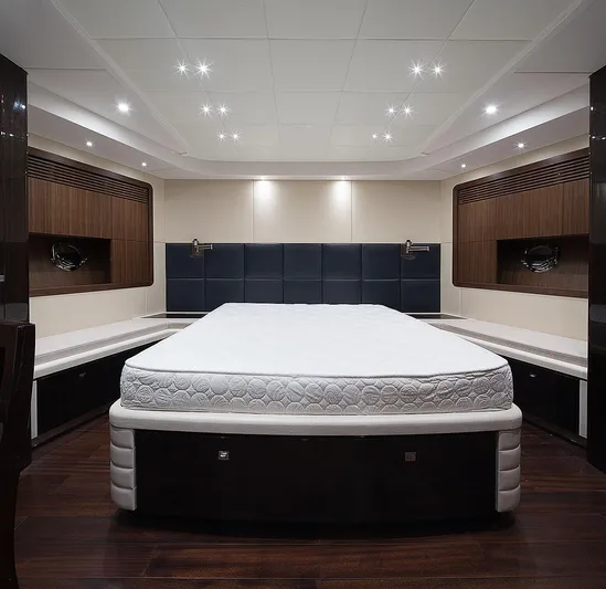  Yacht Photos Pics Luxurious bedroom interior of 2026 Selene 92 Explorer yacht with modern design and ambient lighting.