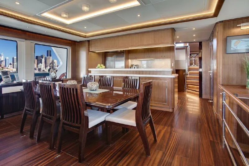  Yacht Photos Pics Luxurious dining area on 2026 Selene 92 Explorer yacht with elegant wood finishes.