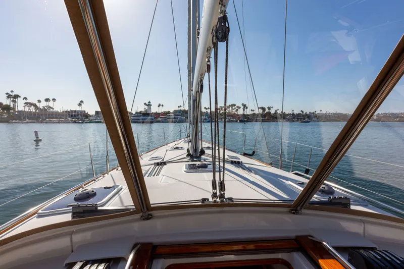 Shenanigans Yacht Photos Pics View from Jeanneau 53DS sailboat deck, 2015 model, overlooking calm marina waters.