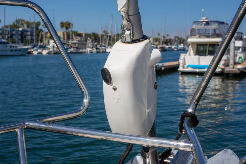 Shenanigans Yacht Photos Pics Jeanneau 53DS 2015 sailboat detail in marina, showcasing rigging and water backdrop.