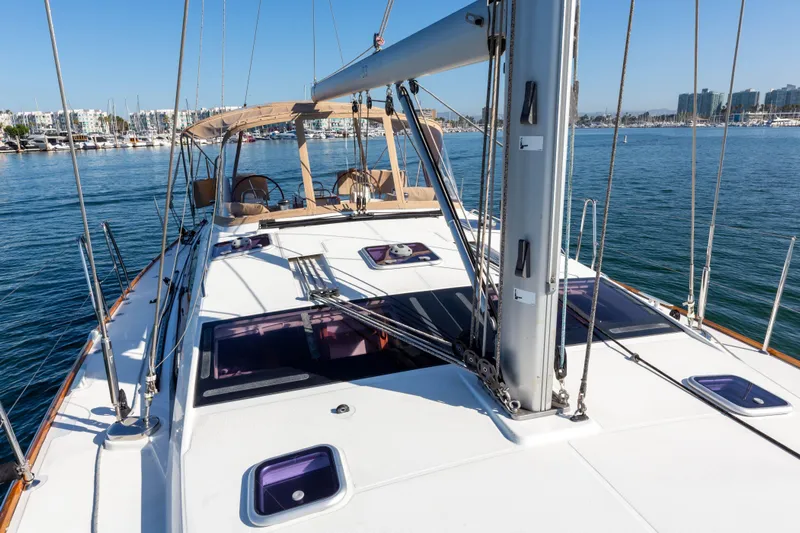 Shenanigans Yacht Photos Pics Jeanneau 53DS 2015 sailboat on calm water, showcasing deck and rigging.