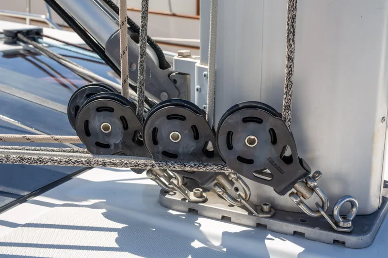 Shenanigans Yacht Photos Pics Close-up of Jeanneau 53DS 2015 sailboat rigging and pulleys on deck.