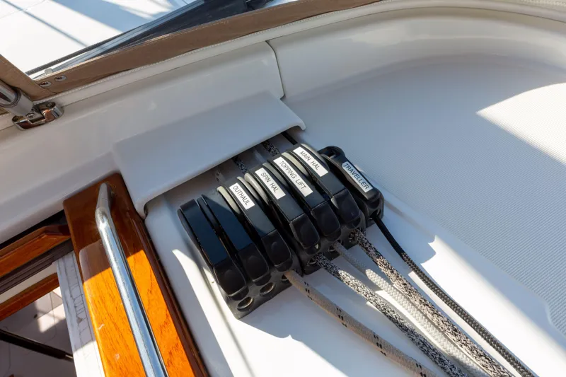 Shenanigans Yacht Photos Pics Jeanneau 53DS 2015 sailboat deck with labeled rope clutches and lines.