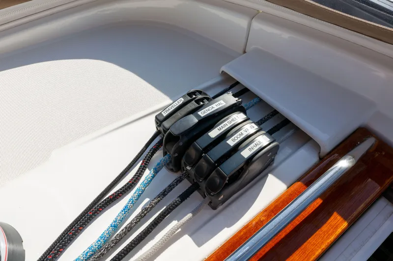 Shenanigans Yacht Photos Pics Close-up of Jeanneau 53DS 2015 sailboat rigging and labeled rope clutches.