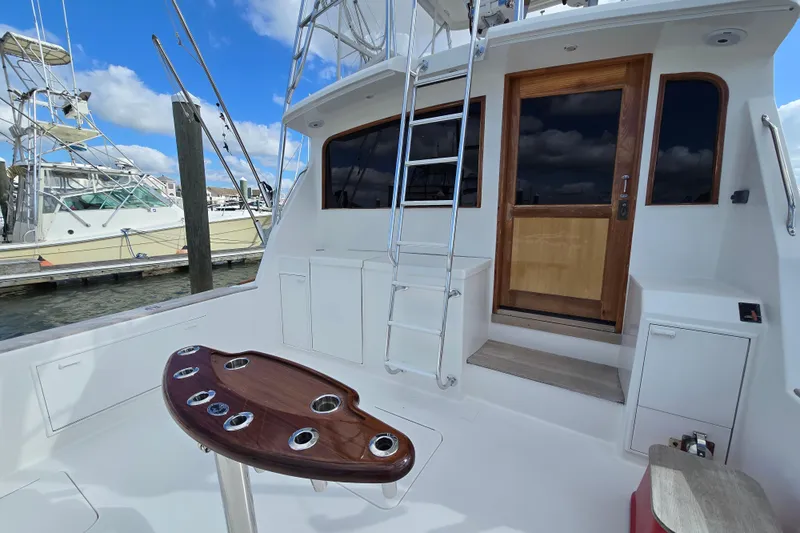  Yacht Photos Pics Ocean Yachts 55 Super Sport 1982, featuring a sleek deck and ladder under a blue sky.