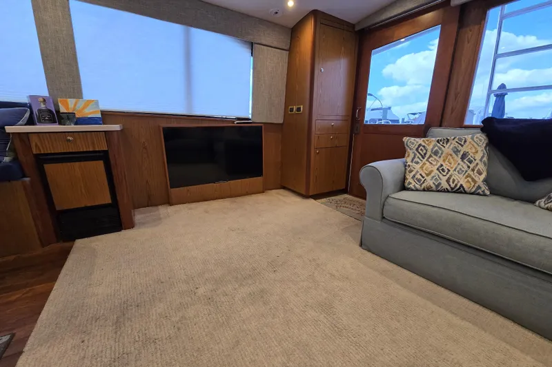  Yacht Photos Pics Luxurious interior of 1982 Ocean Yachts 55 Super Sport, featuring cozy seating and modern amenities.