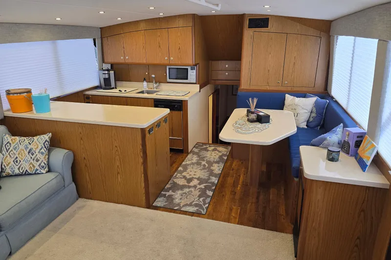  Yacht Photos Pics Interior of 1982 Ocean Yachts 55 Super Sport, featuring modern kitchen and cozy seating area.