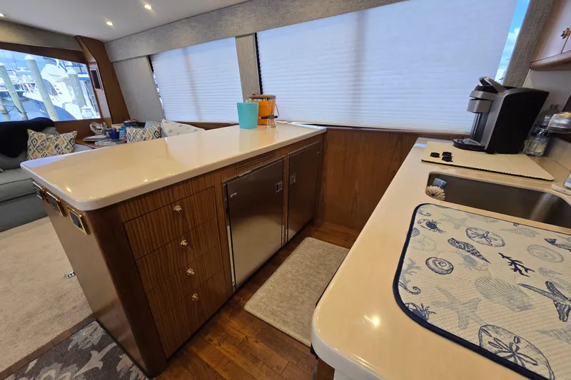 Yacht Photos Pics Luxurious kitchen interior of Ocean Yachts 55 Super Sport, featuring modern appliances and elegant design.