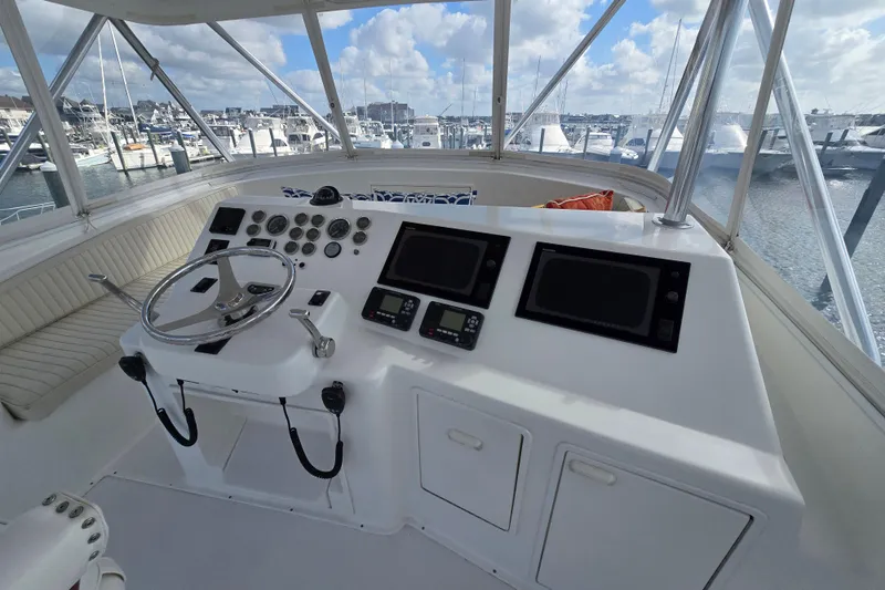  Yacht Photos Pics Helm of Ocean Yachts 55 Super Sport, 1982 model, with marina view.