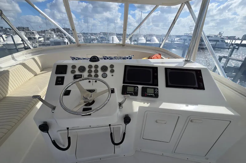  Yacht Photos Pics Cockpit of Ocean Yachts 55 Super Sport 1982, featuring steering wheel and navigation instruments.