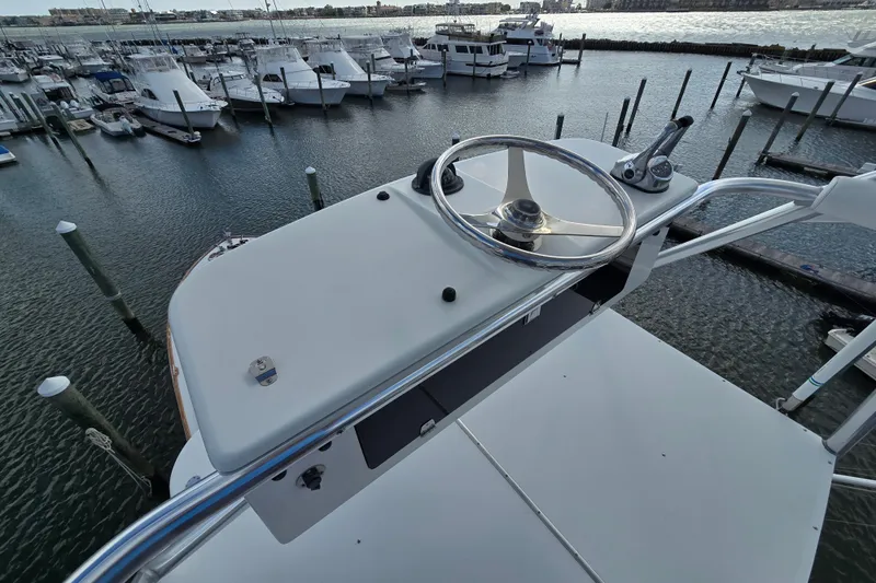  Yacht Photos Pics Helm of Ocean Yachts 55 Super Sport 1982, overlooking marina with docked boats.
