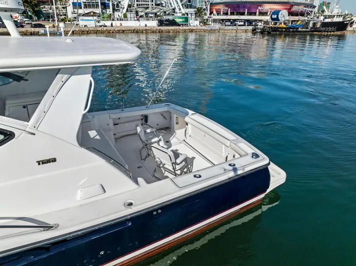 Blue Pearl Yacht Photos Pics 2004 Tiara Yachts 4200 Open docked, featuring spacious deck and sleek design.