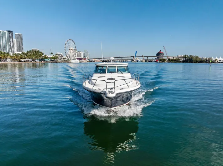 Blue Pearl Yacht Photos Pics 2004 Tiara Yachts 4200 Open cruising in a scenic waterfront setting.