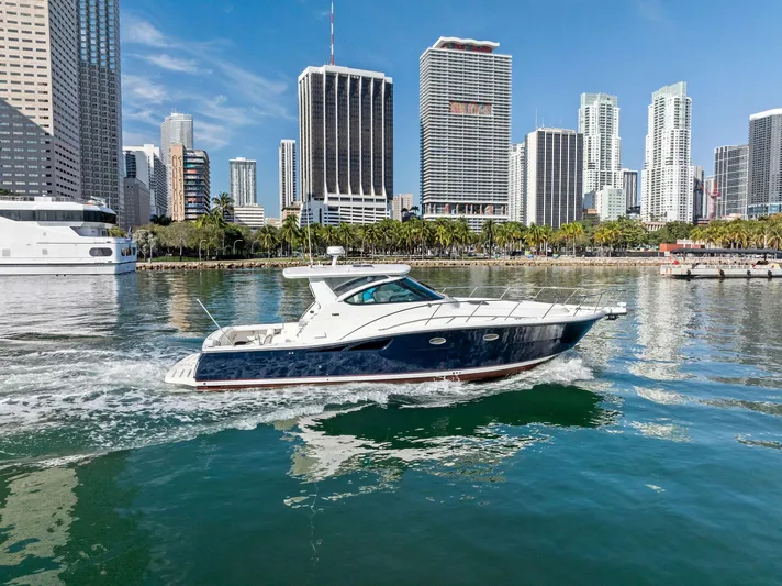 Blue Pearl Yacht Photos Pics 2004 Tiara Yachts 4200 Open cruising in urban waterfront setting.
