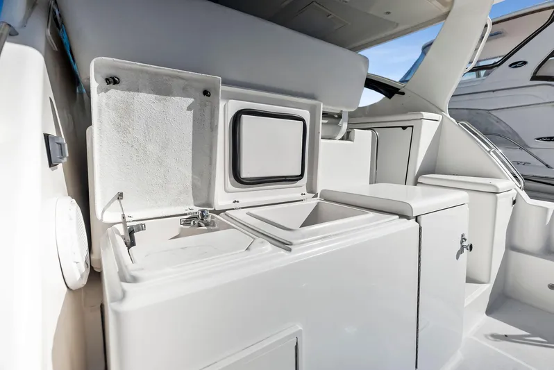 Blue Pearl Yacht Photos Pics 2004 Tiara Yachts 4200 Open interior with storage compartments and sleek design.