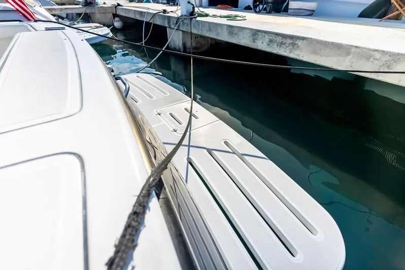 Blue Pearl Yacht Photos Pics 2004 Tiara Yachts 4200 Open docked, showing swim platform and mooring lines.