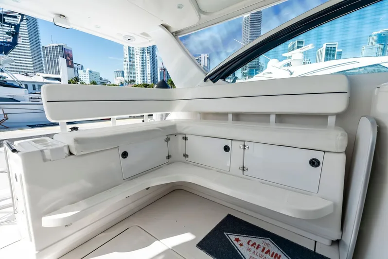 Blue Pearl Yacht Photos Pics 2004 Tiara Yachts 4200 Open interior with white seating and city skyline view.