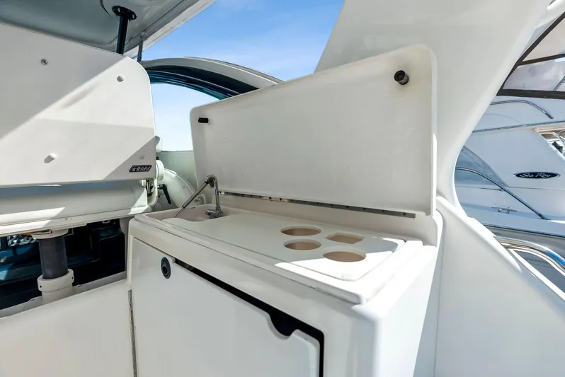 Blue Pearl Yacht Photos Pics Tiara Yachts 4200 Open 2004 model, featuring a sleek onboard kitchenette.