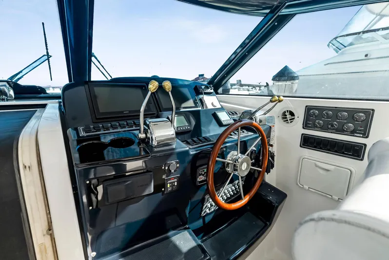 Blue Pearl Yacht Photos Pics 2004 Tiara Yachts 4200 Open helm with steering wheel and control panel.