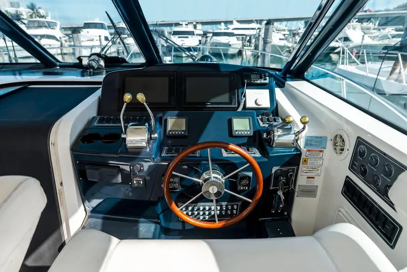 Blue Pearl Yacht Photos Pics 2004 Tiara Yachts 4200 Open helm with modern controls and navigation displays.