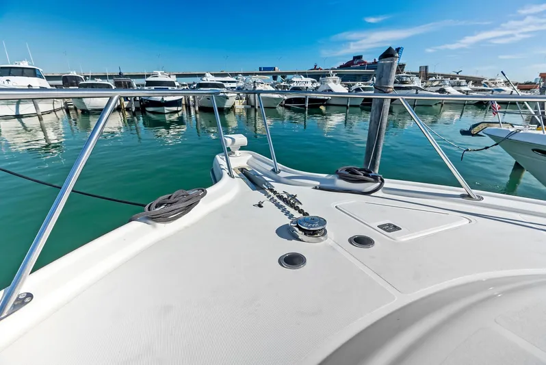 Blue Pearl Yacht Photos Pics 2004 Tiara Yachts 4200 Open at marina, clear blue sky, calm waters.