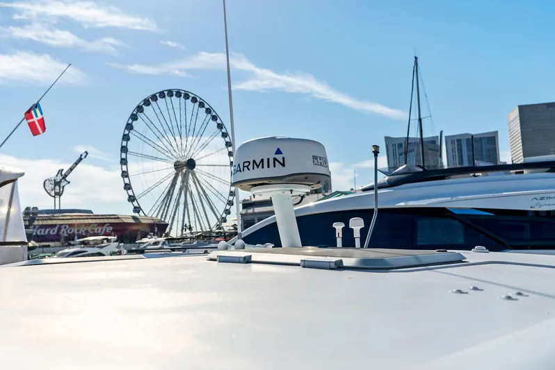 Blue Pearl Yacht Photos Pics 2004 Tiara Yachts 4200 Open with cityscape and Ferris wheel in background.