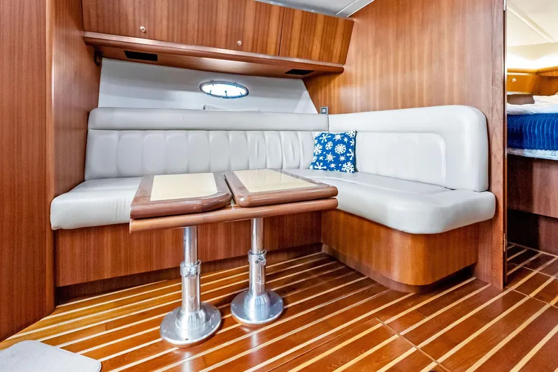 Blue Pearl Yacht Photos Pics 2004 Tiara Yachts 4200 Open interior with wood finish and cushioned seating.