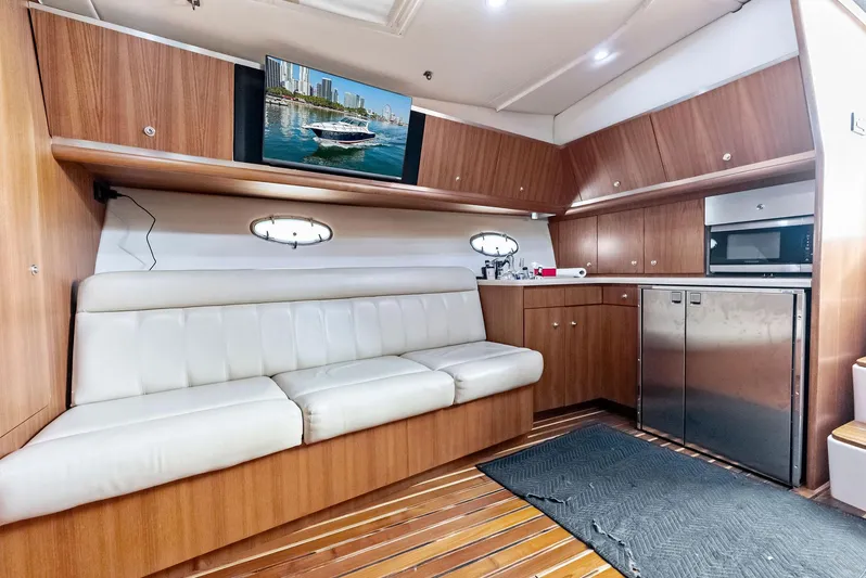 Blue Pearl Yacht Photos Pics Interior of 2004 Tiara Yachts 4200 Open with modern kitchen and seating area.