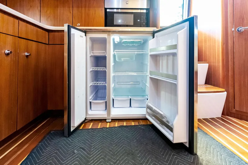 Blue Pearl Yacht Photos Pics Open refrigerator in 2004 Tiara Yachts 4200 Open kitchen interior.