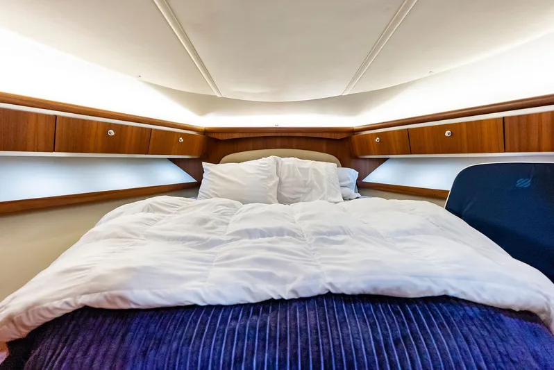 Blue Pearl Yacht Photos Pics Luxurious cabin interior of 2004 Tiara Yachts 4200 Open with cozy bedding.