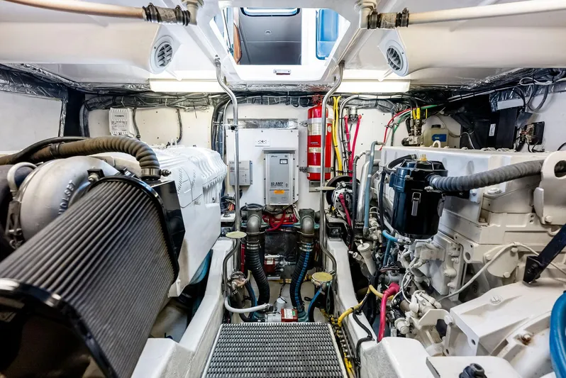 Blue Pearl Yacht Photos Pics Engine room of 2004 Tiara Yachts 4200 Open, showcasing mechanical components and wiring.