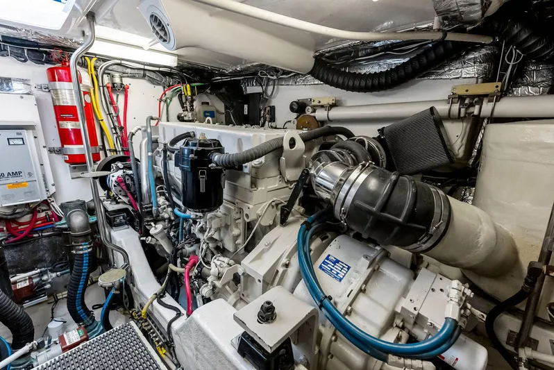 Blue Pearl Yacht Photos Pics Engine room of 2004 Tiara Yachts 4200 Open, showcasing complex machinery and wiring.