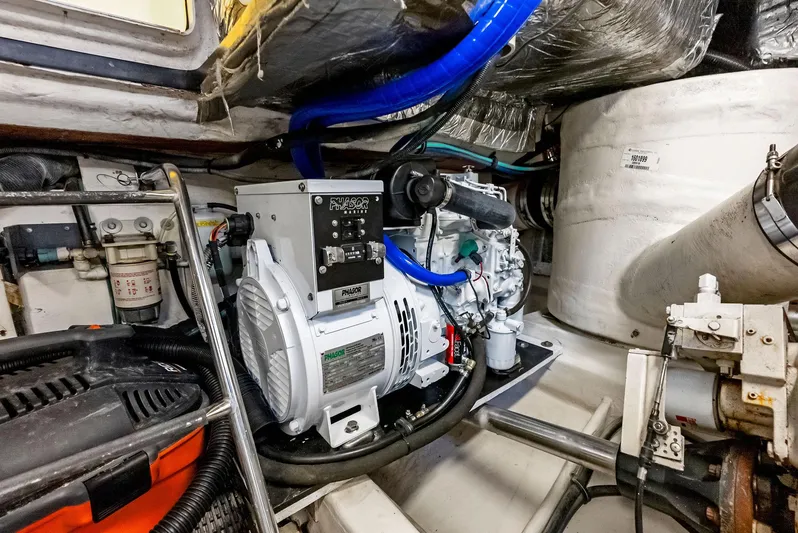 Blue Pearl Yacht Photos Pics Engine room of 2004 Tiara Yachts 4200 Open, showcasing mechanical components and equipment.