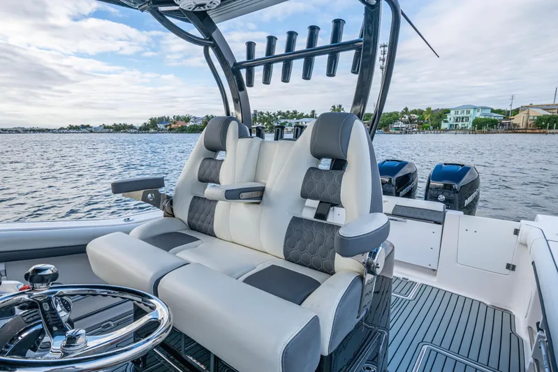 Going Propless Yacht Photos Pics 2020 Tidewater 320 CC Adventure boat interior with luxurious seating and dual engines.
