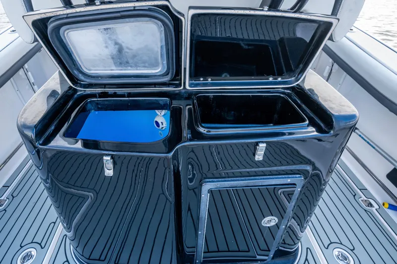 Going Propless Yacht Photos Pics 2020 Tidewater 320 CC Adventure boat with open storage compartments on deck.