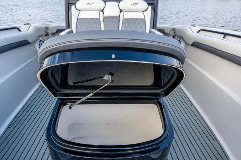 Going Propless Yacht Photos Pics 2020 Tidewater 320 CC Adventure boat with open storage compartment on deck.