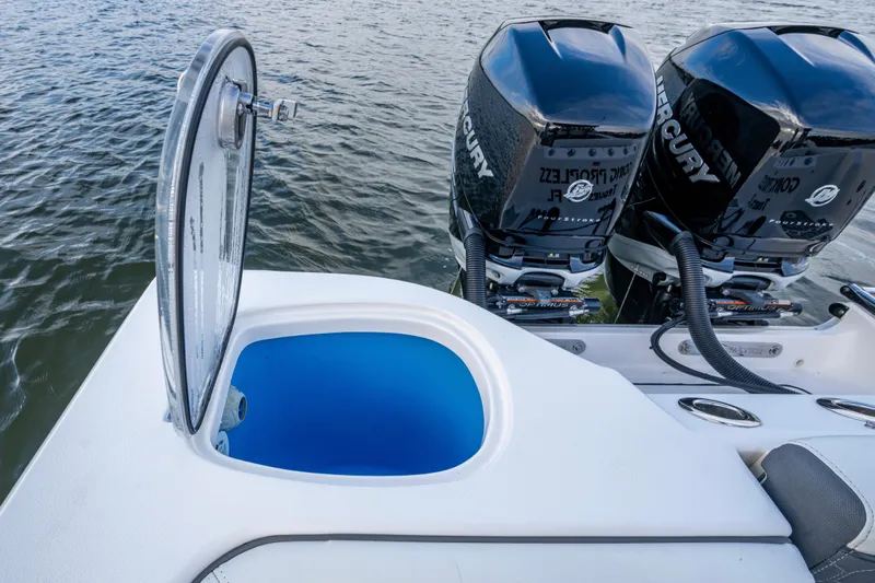 Going Propless Yacht Photos Pics 2020 Tidewater 320 CC Adventure boat with open hatch and twin Mercury engines.