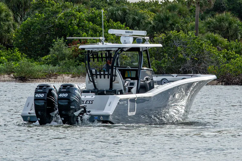 Going Propless Yacht Photos Pics 2020 Tidewater 320 CC Adventure boat cruising on water with twin 400 engines.