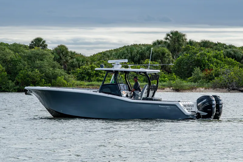 Going Propless Yacht Photos Pics 2020 Tidewater 320 CC Adventure boat cruising on a scenic waterway.