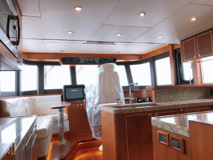  Yacht Photos Pics Luxurious interior of 2026 Selene 60 Explorer yacht with modern helm and seating.