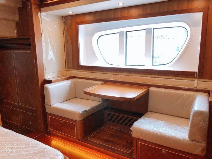  Yacht Photos Pics Luxurious interior of 2026 Selene 60 Explorer yacht with elegant seating and large window.