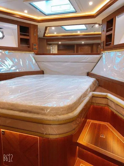  Yacht Photos Pics Luxurious cabin interior of 2026 Selene 60 Explorer yacht with wood finish and skylight.